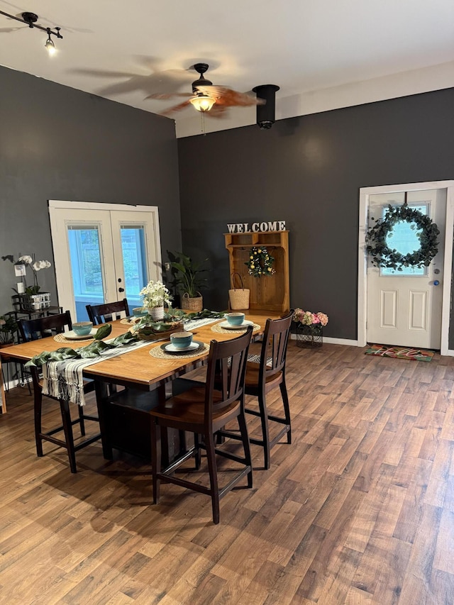 1581 W Lone Pine Dr, Baldwin, MI 49304 - dining area featuring ceiling fan, wood finished floors, french doors, and rail lighting