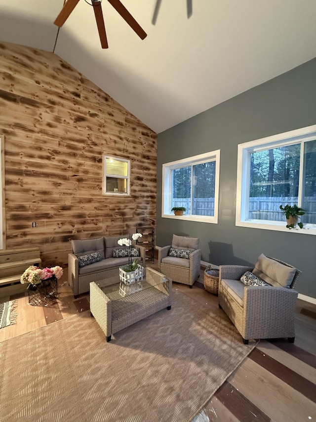 1581 W Lone Pine Dr, Baldwin, MI 49304 - living area featuring a ceiling fan, wood finished floors, plenty of natural light, and vaulted ceiling