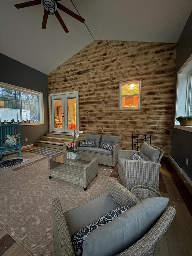 1581 W Lone Pine Dr, Baldwin, MI 49304 - living room featuring ceiling fan, high vaulted ceiling, wood finished floors, and baseboards
