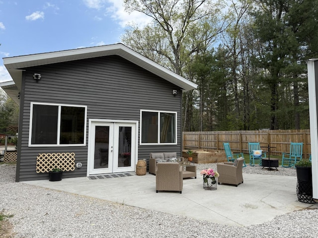 1581 W Lone Pine Dr, Baldwin, MI 49304 - rear view of house featuring a patio, french doors, and an outdoor living space with a fire pit