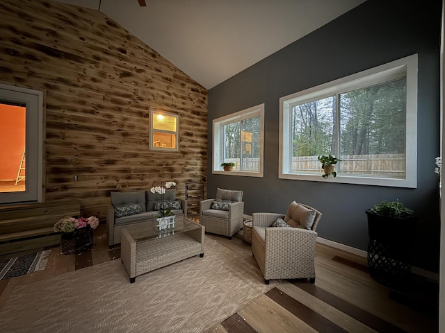 1581 W Lone Pine Dr, Baldwin, MI 49304 - sitting room with wood finished floors, baseboards, and high vaulted ceiling