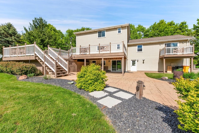 5576 Kidder Rd, Almont, MI 48003 - rear view of property with a patio, a deck, a lawn, and stairway