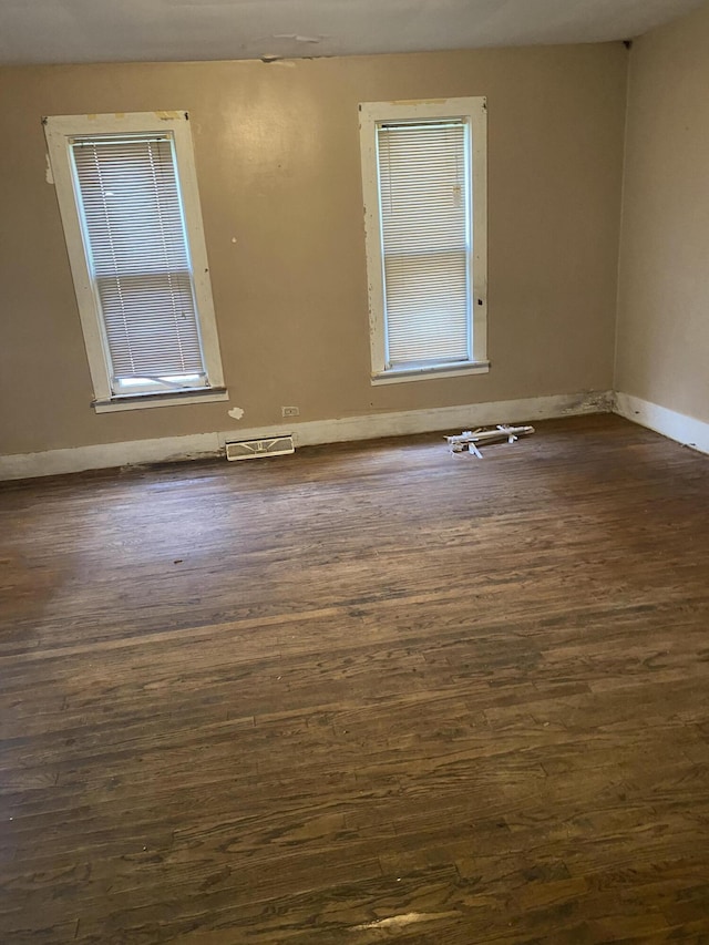 525 NE Eastern Ave NE, Grand Rapids, MI 49503 - empty room with dark wood finished floors and baseboards