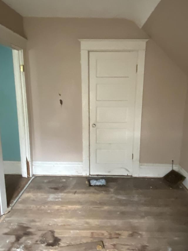 525 NE Eastern Ave NE, Grand Rapids, MI 49503 - interior space with wood finished floors, vaulted ceiling, and baseboards