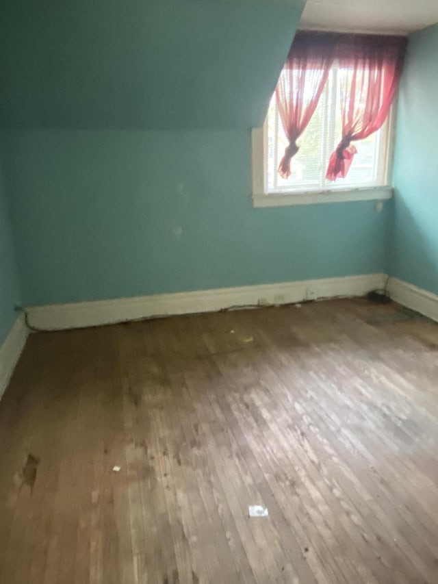 525 NE Eastern Ave NE, Grand Rapids, MI 49503 - bonus room featuring hardwood / wood-style floors and baseboards