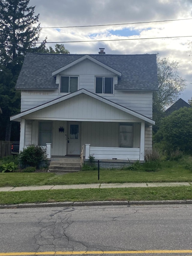 525 NE Eastern Ave NE, Grand Rapids, MI 49503 - bungalow-style house featuring covered porch and a shingled roof