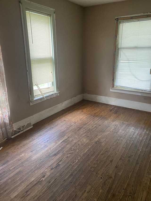 525 NE Eastern Ave NE, Grand Rapids, MI 49503 - empty room with dark wood-type flooring and baseboards