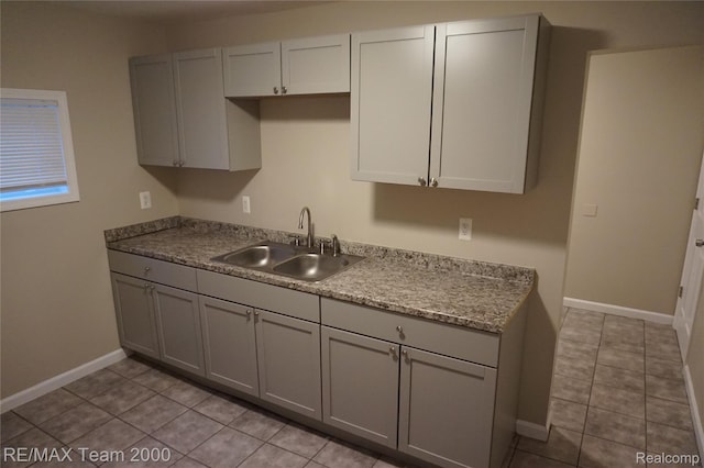 29619 Hazelwood St, Inkster, MI 48141 - kitchen with a sink, light tile patterned floors, gray cabinets, and baseboards