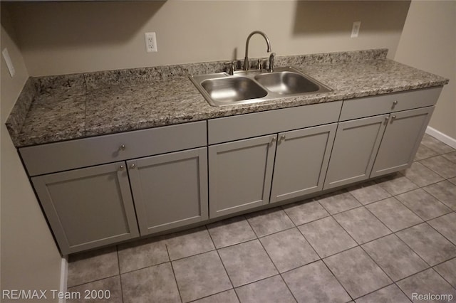29619 Hazelwood St, Inkster, MI 48141 - kitchen with a sink, gray cabinetry, light tile patterned flooring, and light countertops