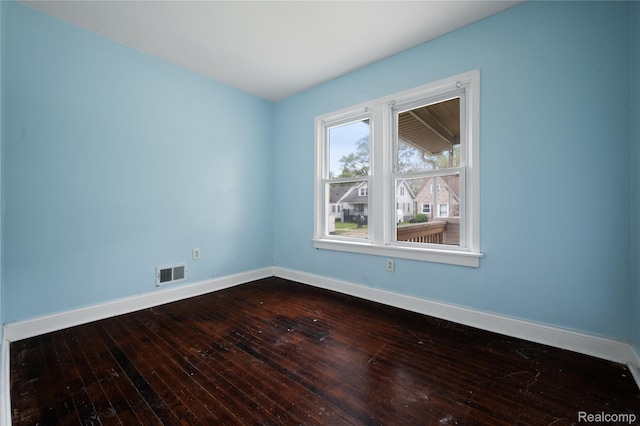 18666 Carrie St, Hamtramck, MI 48234 - unfurnished room with baseboards and dark wood-type flooring