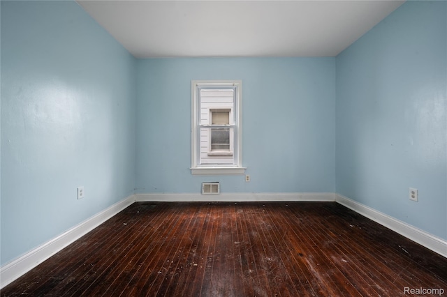 18666 Carrie St, Hamtramck, MI 48234 - spare room featuring hardwood / wood-style floors and baseboards