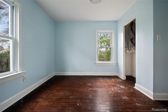 18666 Carrie St, Hamtramck, MI 48234 - unfurnished bedroom with hardwood / wood-style flooring and baseboards