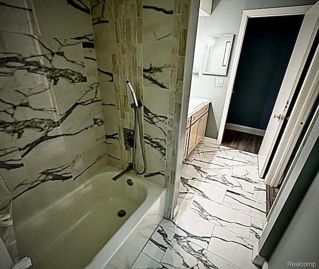 31322 Leota St, Fraser, MI 48026 - full bath with marble look tiles, tub / shower combination, vanity, and baseboards