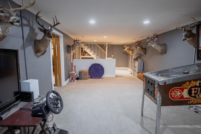 1905 Ora St, Muskegon, MI 49445 - finished below grade area with carpet flooring, recessed lighting, stairs, baseboards, and concrete block wall