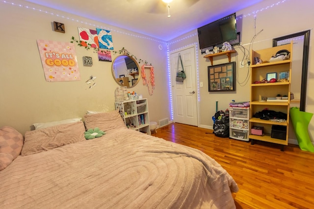 1905 Ora St, Muskegon, MI 49445 - bedroom with wood finished floors and baseboards