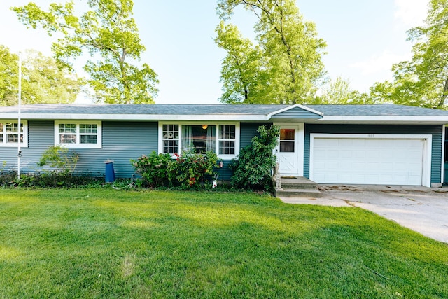 1905 Ora St, Muskegon, MI 49445 - ranch-style home with a garage, a front yard, and driveway