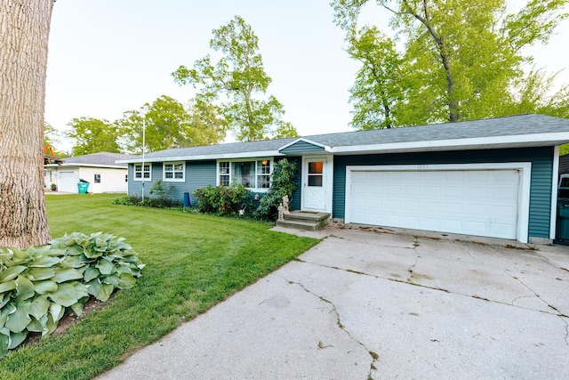 1905 Ora St, Muskegon, MI 49445 - ranch-style home featuring an attached garage, driveway, and a front yard