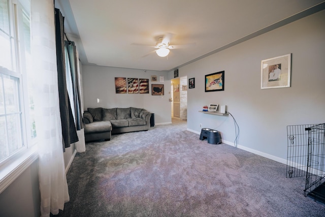 1905 Ora St, Muskegon, MI 49445 - carpeted living room with a ceiling fan, baseboards, and ornamental molding