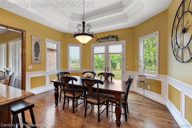 1181 Iroquois Trl, Oxford, MI 48371 - dining area featuring crown molding, wainscoting, a tray ceiling, dark wood-style floors, and french doors