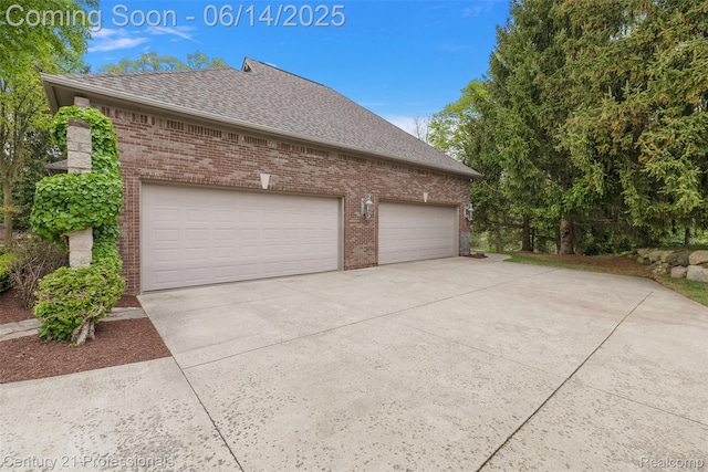 1181 Iroquois Trl, Oxford, MI 48371 - view of side of home with brick siding, a shingled roof, concrete driveway, and a garage