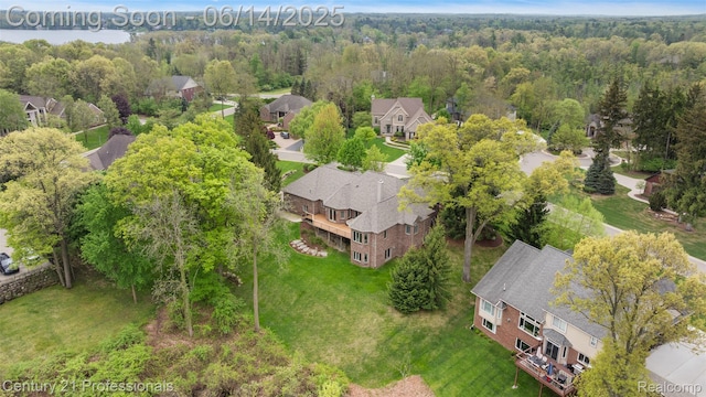 1181 Iroquois Trl, Oxford, MI 48371 - aerial perspective of suburban area featuring a heavily wooded area