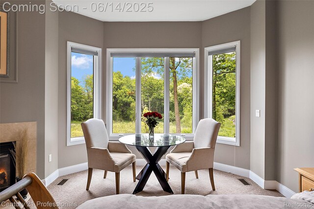 1181 Iroquois Trl, Oxford, MI 48371 - dining area featuring light colored carpet and a fireplace