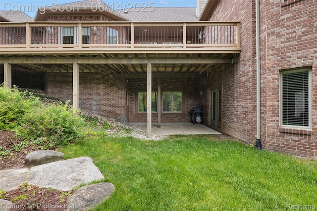 1181 Iroquois Trl, Oxford, MI 48371 - rear view of property with a patio, brick siding, a lawn, and a deck