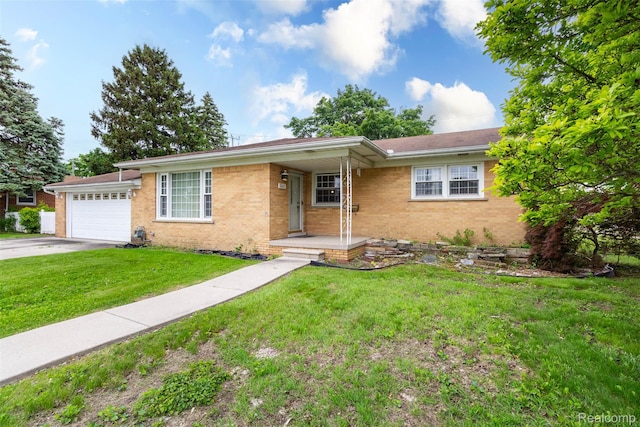 25547 Jennifer St, Redford, MI 48239 - ranch-style home featuring brick siding, an attached garage, driveway, and a front lawn