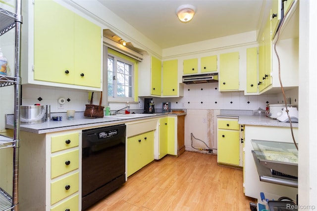 25547 Jennifer St, Redford, MI 48239 - kitchen featuring dishwasher, tasteful backsplash, yellow cabinetry, light wood-style floors, and light countertops
