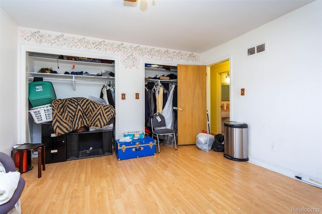 25547 Jennifer St, Redford, MI 48239 - bedroom with multiple closets and wood finished floors