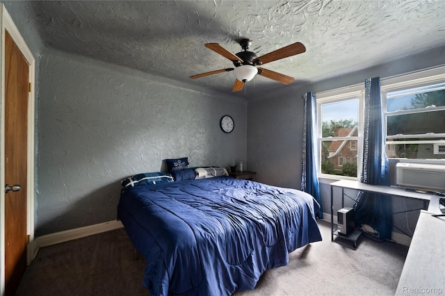 12518 Corbett St, Hamtramck, MI 48213 - carpeted bedroom featuring baseboards, a textured wall, a ceiling fan, cooling unit, and a textured ceiling