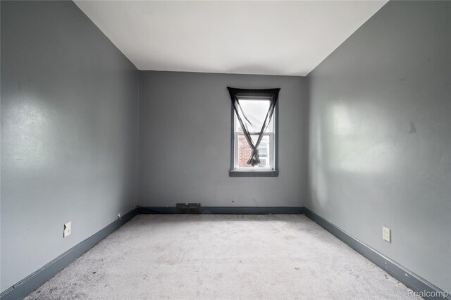 12518 Corbett St, Hamtramck, MI 48213 - spare room featuring light carpet and baseboards
