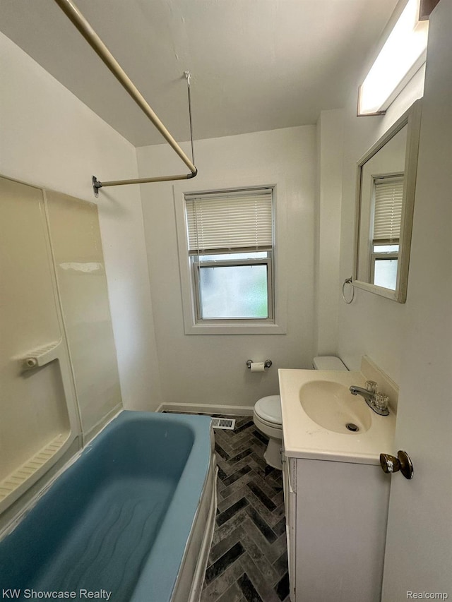 459 E Breckenridge St, Ferndale, MI 48220 - bathroom featuring brick flooring, vanity, toilet, shower / tub combination, and baseboards
