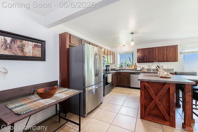 22571 E 13 Mile Rd, Saint Clair Shores, MI 48082 - kitchen featuring appliances with stainless steel finishes, dark countertops, light tile patterned floors, a sink, and hanging light fixtures