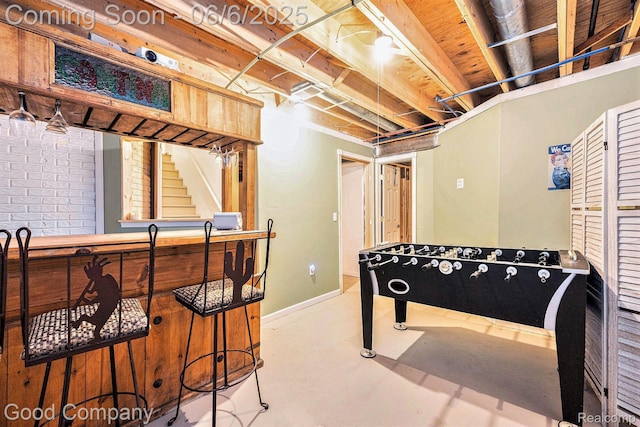 22571 E 13 Mile Rd, Saint Clair Shores, MI 48082 - rec room with concrete flooring, bar area, and baseboards