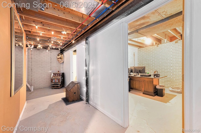 22571 E 13 Mile Rd, Saint Clair Shores, MI 48082 - unfinished basement featuring brick wall and baseboards