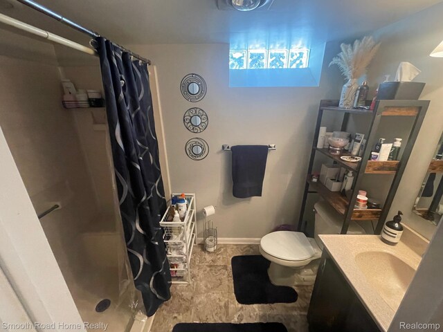 1525 Ackley Ave, Westland, MI 48186 - full bath with vanity, a stall shower, toilet, and baseboards