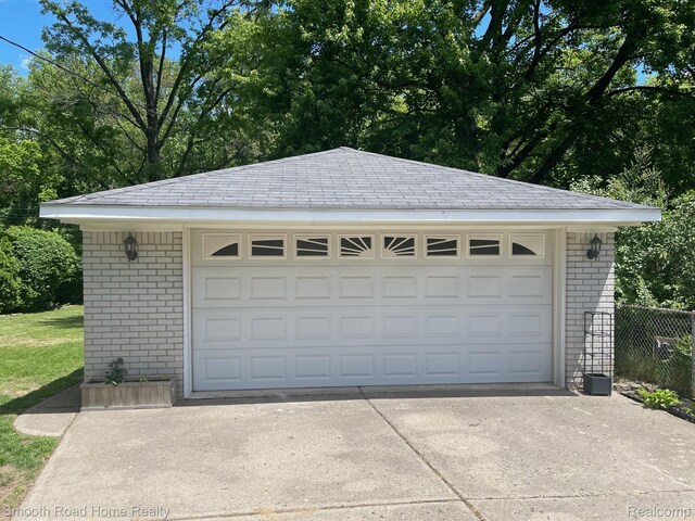 1525 Ackley Ave, Westland, MI 48186 - detached garage featuring view of scattered trees