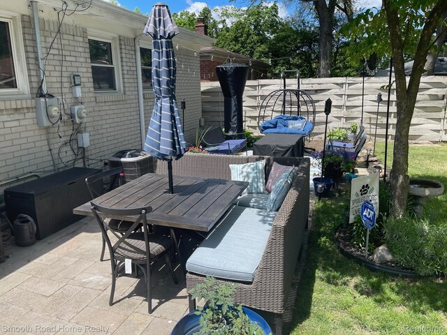 1525 Ackley Ave, Westland, MI 48186 - view of patio / terrace with cooling unit, outdoor dining area, and an outdoor living space