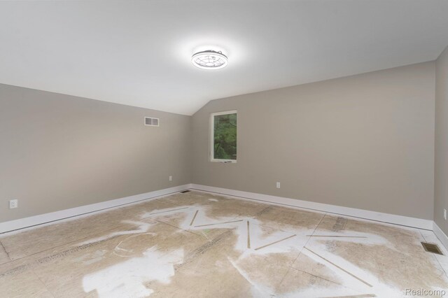 1439 Merry Rd, Waterford, MI 48328 - spare room featuring vaulted ceiling and baseboards
