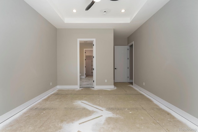 1439 Merry Rd, Waterford, MI 48328 - unfurnished bedroom featuring a tray ceiling, recessed lighting, and ceiling fan