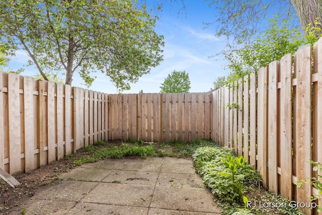2463 Abbington Dr SE, Grand Rapids, MI 49506 - fenced backyard featuring a patio