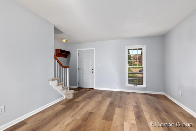 2463 Abbington Dr SE, Grand Rapids, MI 49506 - foyer featuring wood finished floors and stairs