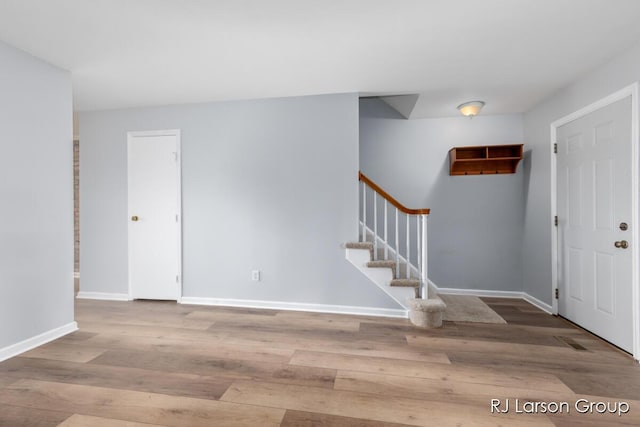2463 Abbington Dr SE, Grand Rapids, MI 49506 - entrance foyer featuring stairway and wood finished floors