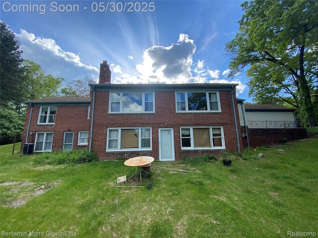 30430 Inkster Rd, Franklin, MI 48025 - rear view of house with a yard, a chimney, and brick siding