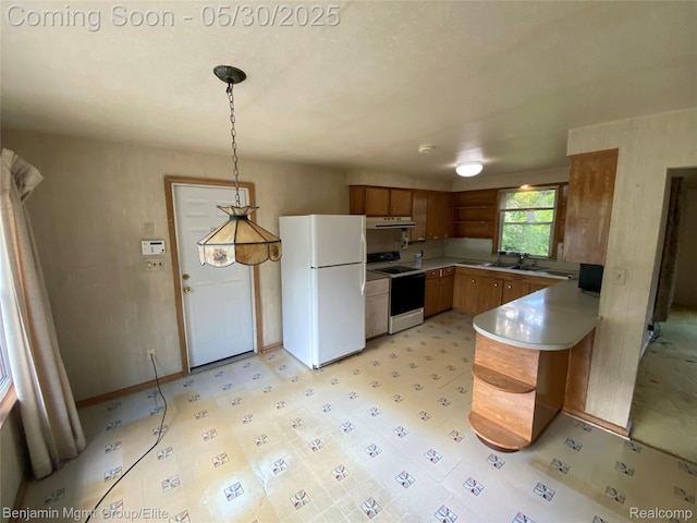 30430 Inkster Rd, Franklin, MI 48025 - kitchen featuring white appliances, a peninsula, under cabinet range hood, brown cabinetry, and decorative light fixtures