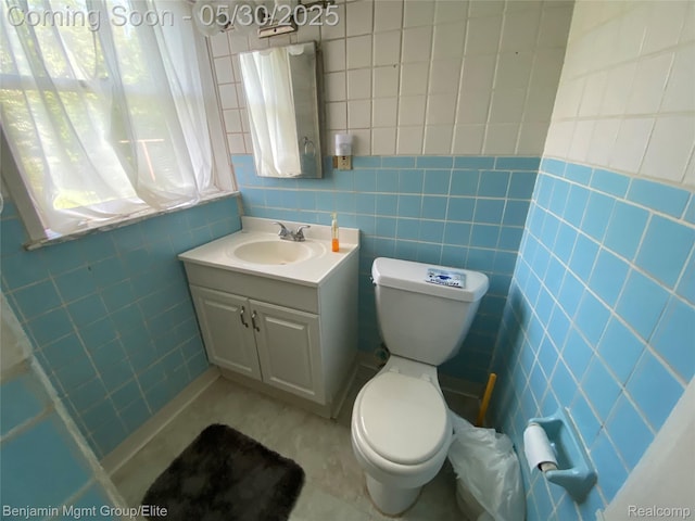 30430 Inkster Rd, Franklin, MI 48025 - bathroom featuring tile walls, vanity, toilet, and tile patterned flooring