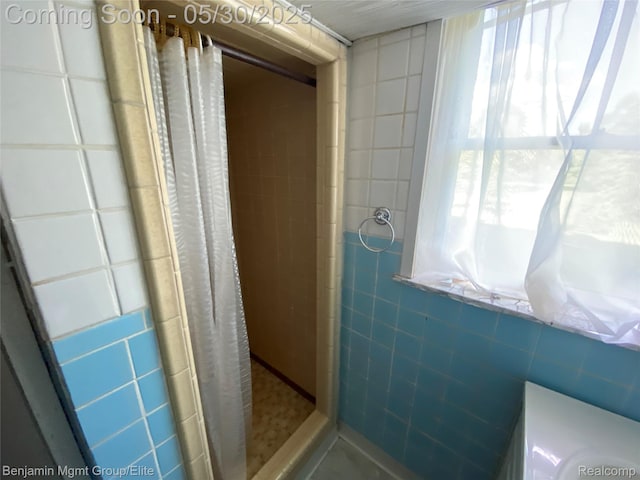 30430 Inkster Rd, Franklin, MI 48025 - full bathroom featuring tile walls and a stall shower