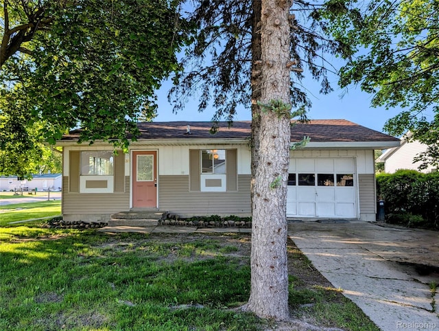 190 Main St, Sebewaing, MI 48759 - ranch-style home featuring concrete driveway, an attached garage, entry steps, and a front yard