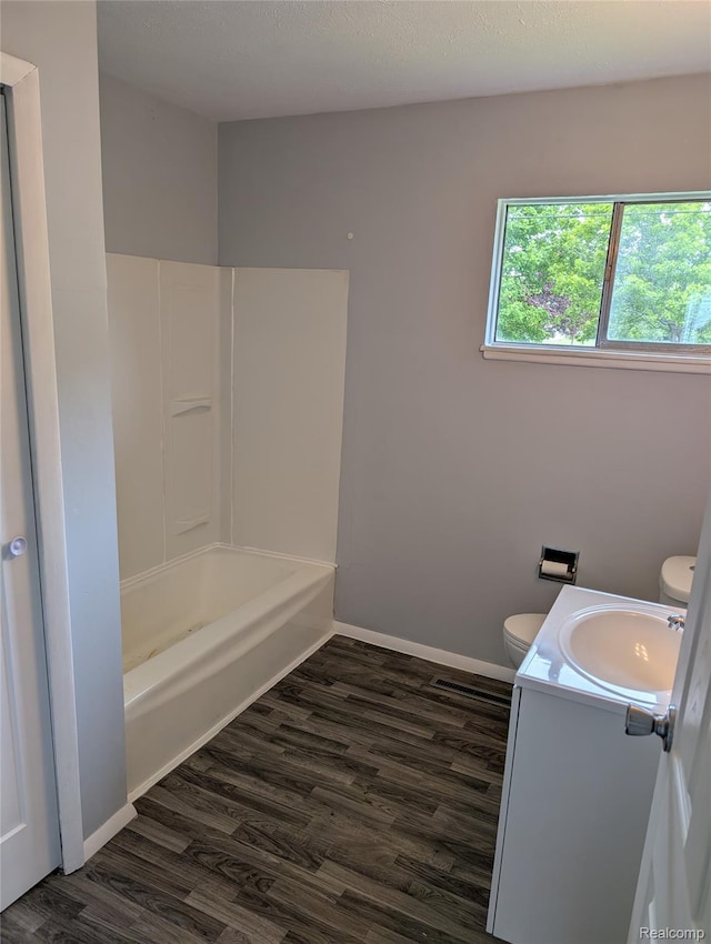 190 Main St, Sebewaing, MI 48759 - bathroom with toilet, wood finished floors, vanity, and baseboards